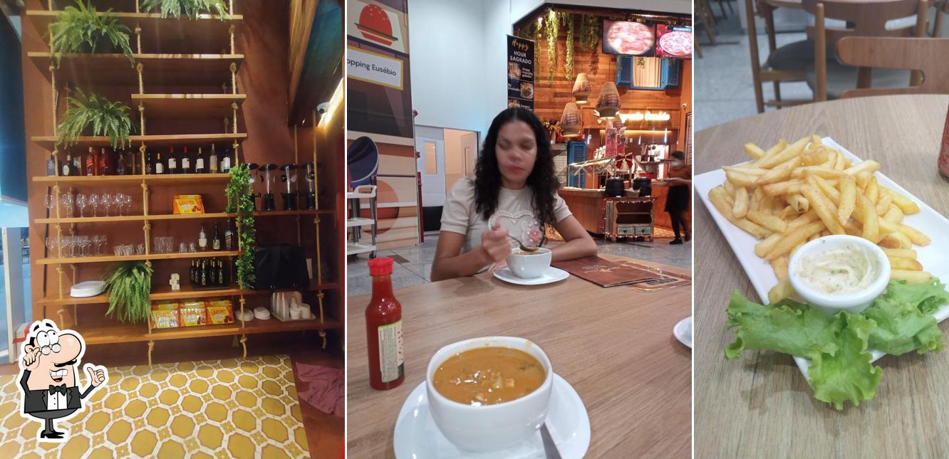 Sente em uma das mesas no Sagrada Comida