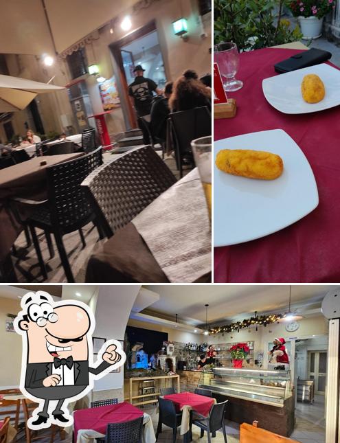 Siediti a un tavolo di Real Pizza