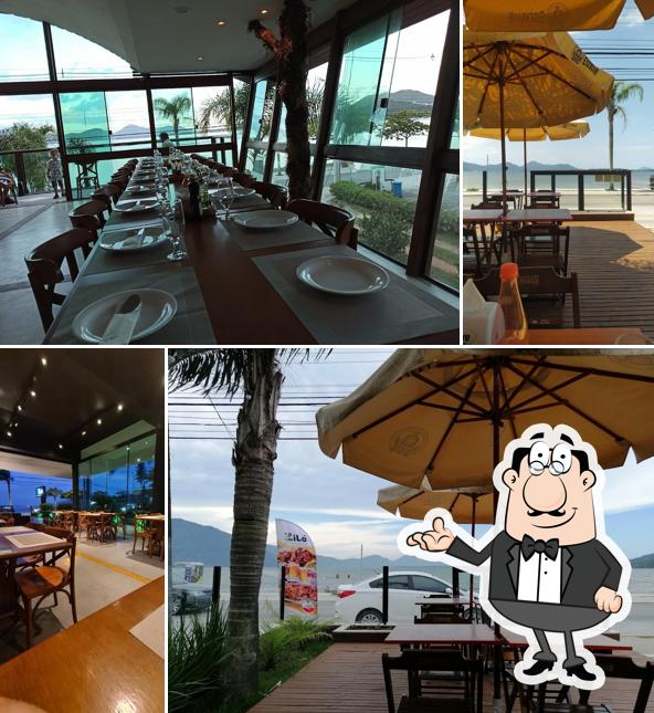 Sente em uma das mesas no Zilá Restaurante & Eventos