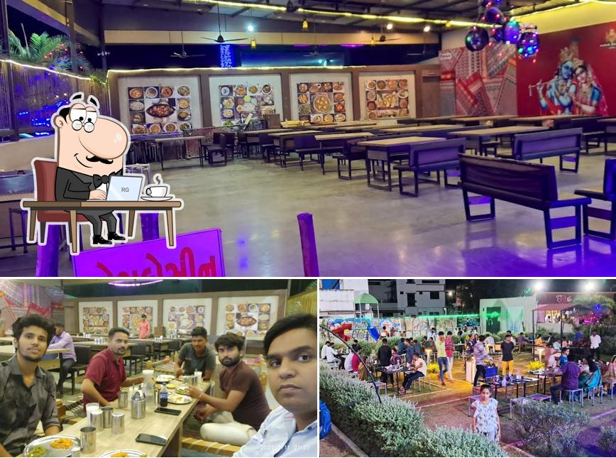 Take a seat at one of the tables at Radhe Rajwadi hotel