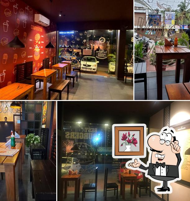 Take a seat at one of the tables at Burger Lounge, Muvattupuzha