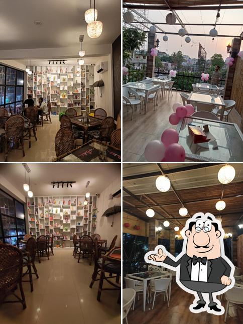 Take a seat at one of the tables at Cafe Pikkuli Kankarbagh