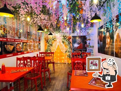 Take a seat at one of the tables at Orient Cafe