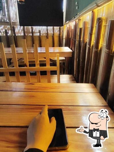 Take a seat at one of the tables at Delicious Padosi